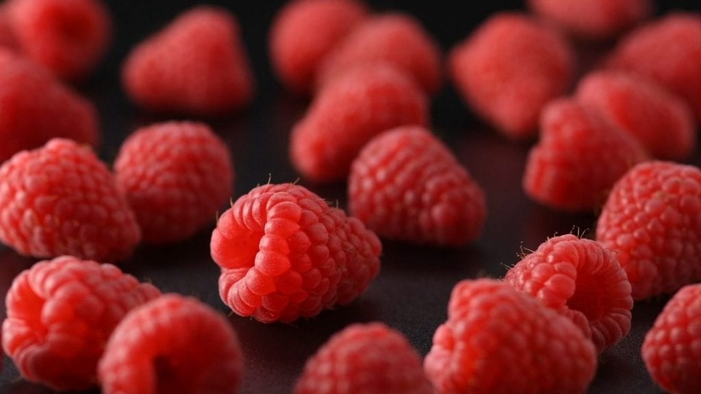Video of Raspberries being sprinkled with icing sugar