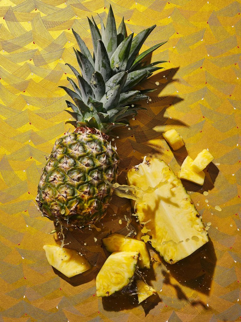 Pineapple whole and cut with juice splash