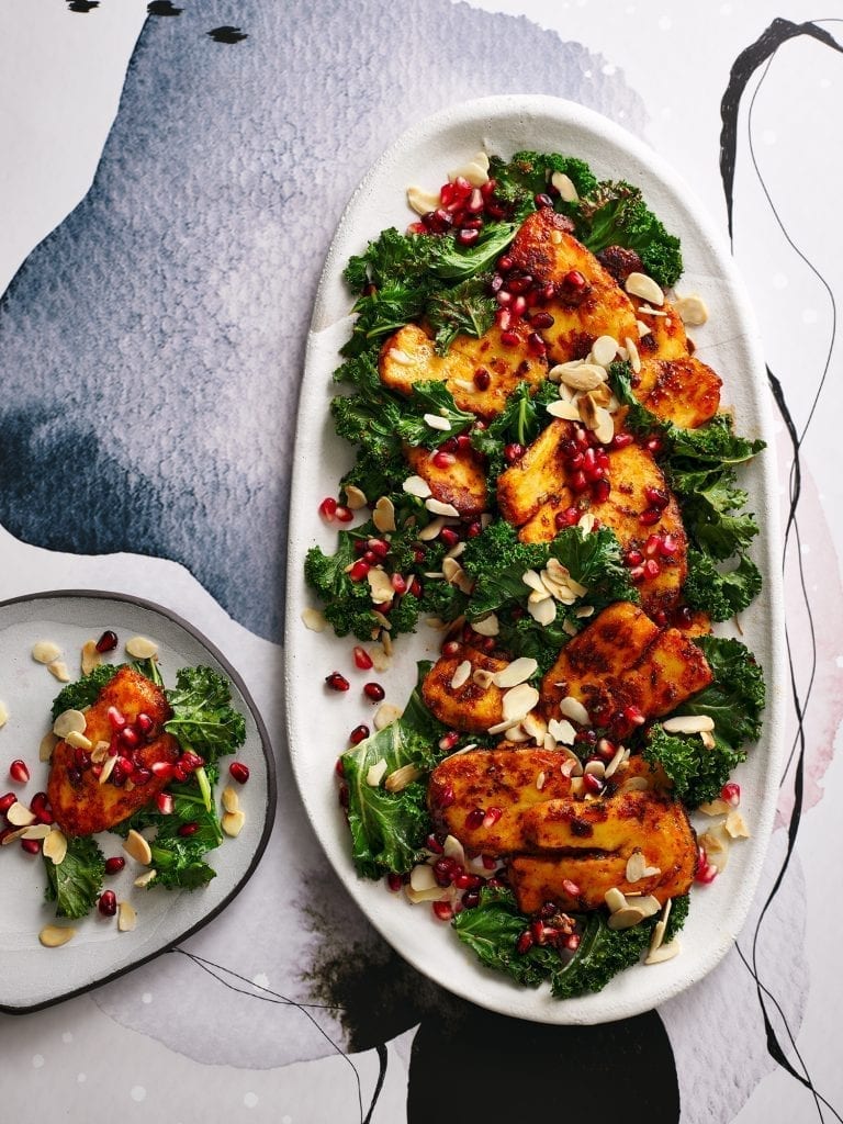 Romy Gill's Chilli honey halloumi kale pomegranate almond warm salad photographed for the sunday times